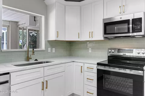 Kitchen - 2225 Pine Tree Dr, Edgewater, FL 32141 photo 2 of 5