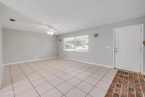 Living - 3132 Pine Tree Dr, Edgewater, FL 32141 photo 2 of 6