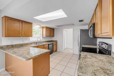 Kitchen - 3132 Pine Tree Dr, Edgewater, FL 32141 photo 2 of 5