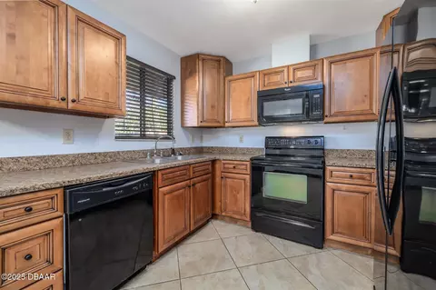 Kitchen - 909 Brookside Dr, Ormond Beach, FL 32174 photo 2 of 2