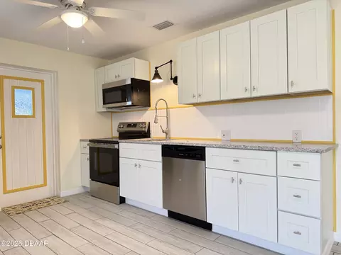 Kitchen - 302 Adele St, Edgewater, FL 32132 photo 3 of 11