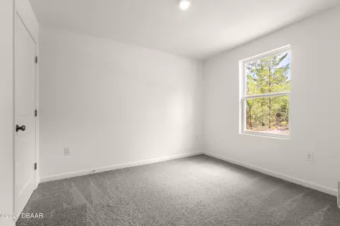 Bedroom - 5540 Chestnut Ave, Bunnell, FL 32110 photo 2 of 4