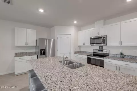 Kitchen - 8 Melogold Dr, Ormond Beach, FL 32174 photo 2 of 7