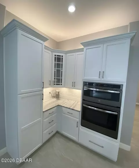 Kitchen - 1452 Pecos Dr, Ormond Beach, FL 32174 photo 5 of 7