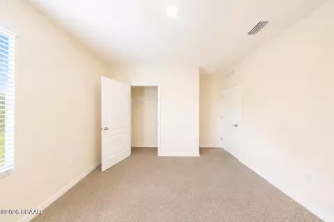 Bedroom - 21 Melogold Dr, Ormond Beach, FL 32174 photo 7 of 9