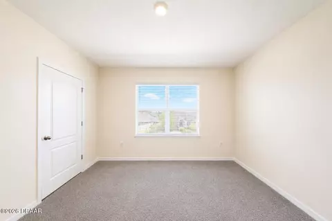 Bedroom - 21 Melogold Dr, Ormond Beach, FL 32174 photo 8 of 9