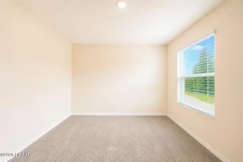 Bedroom - 21 Melogold Dr, Ormond Beach, FL 32174 photo 6 of 9