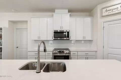 Kitchen - 345 E Merimont Ln E, Ormond Beach, FL 32174 photo 8 of 8