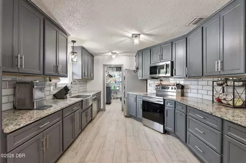 Kitchen - 1629 Orange Tree Dr, Edgewater, FL 32132 photo 4 of 5