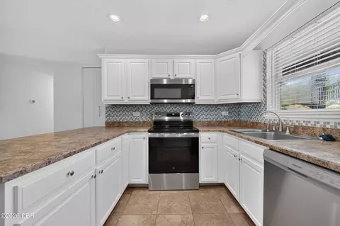 Kitchen - 911 Woodmere Cir, Ormond Beach, FL 32174 photo 2 of 2