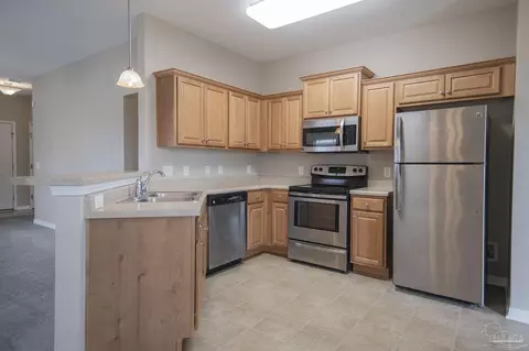 Kitchen - 5789 Corkscrew Ct, Pace, FL 32571 photo 2 of 4