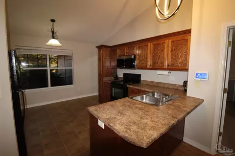 Kitchen - 5501 Riviera Dr, Milton, FL 32583 photo 3 of 4