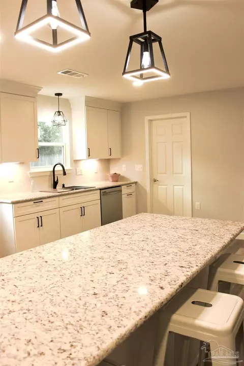 Kitchen - 4448 Pine Villa Cir, Pace, FL 32571 photo 13 of 17