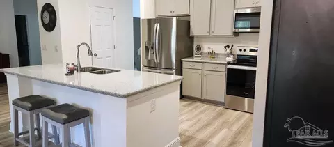 Kitchen - 7652 Piper Cir, Milton, FL 32583 photo 2 of 3