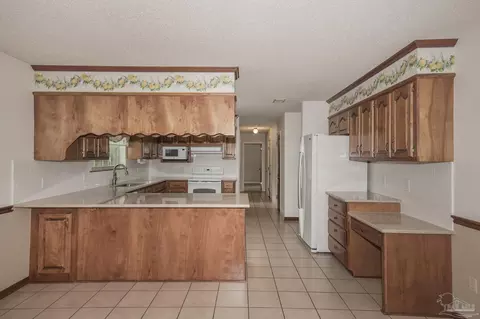 Kitchen - 3918 Wiley Penton Rd, Pace, FL 32571 photo 5 of 5