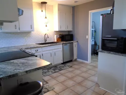 Kitchen - 7067 Pine Blossom Rd, Milton, FL 32570 photo 2 of 4