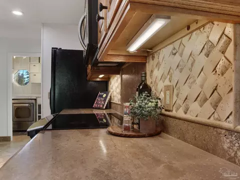 Kitchen - 5748 Dove Dr, Pace, FL 32571 photo 8 of 9
