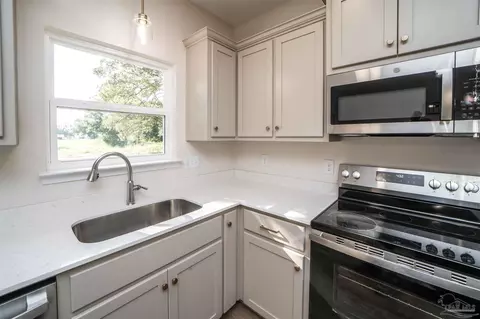 Kitchen - 5597 Crestwood Dr, Milton, FL 32583 photo 2 of 3