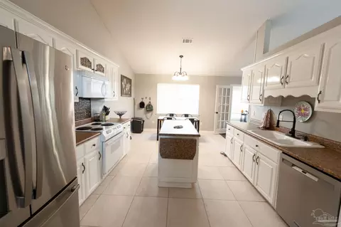Kitchen - 5565 Whispering Woods Dr, Pace, FL 32571 photo 3 of 5