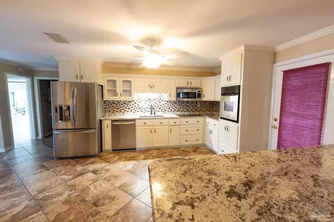 Kitchen - 7608 River Rd, Milton, FL 32583 photo 2 of 3