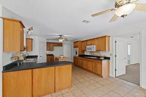 Kitchen - 5092 E Spencer Field Rd, Pace, FL 32571 photo 2 of 8