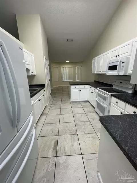 Kitchen - 11739 Old Course Rd, Cantonment, FL 32533 photo 3 of 3