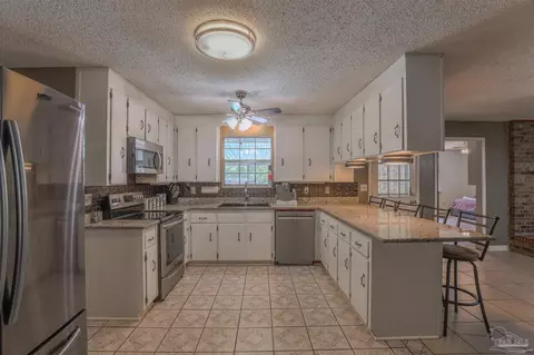 Kitchen - 4576 Woodbine Rd, Pace, FL 32571 photo 2 of 2