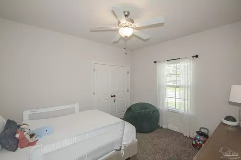 Bedroom - 5978 W Cambridge Way, Pace, FL 32571 photo 8 of 10