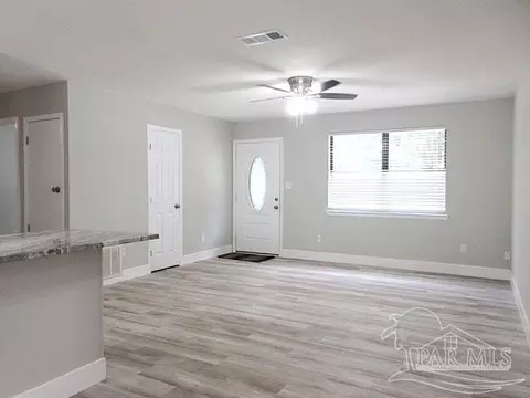 Living - 5143 Oakleaf Dr, Pace, FL 32571 photo 9 of 9