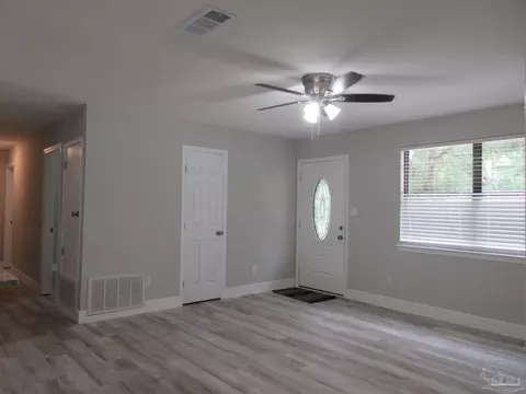 Living - 5143 Oakleaf Dr, Pace, FL 32571 photo 6 of 9