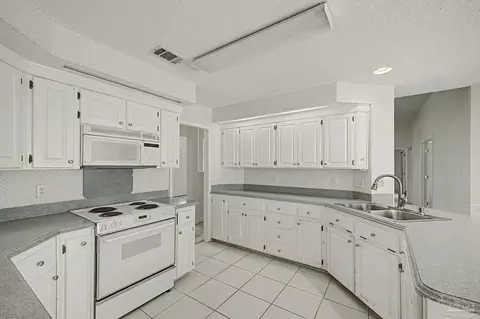 Kitchen - 5775 Whispering Woods Dr, Pace, FL 32571 photo 4 of 6