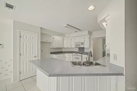 Kitchen - 5775 Whispering Woods Dr, Pace, FL 32571 photo 3 of 6