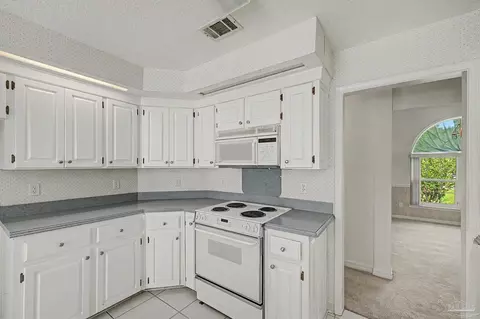 Kitchen - 5775 Whispering Woods Dr, Pace, FL 32571 photo 6 of 6