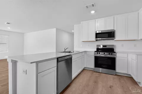 Kitchen - 6494 Buckthorn Cir #HS 26C, Pace, FL 32571 photo 6 of 7
