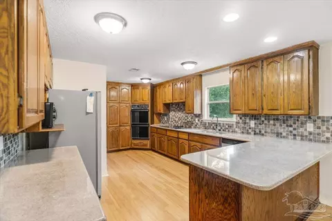 Kitchen - 1886 Lodgepole Dr, Milton, FL 32583 photo 2 of 3