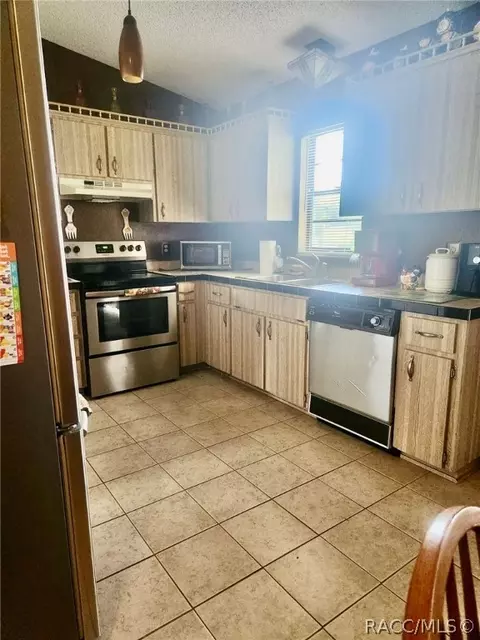 Kitchen - 9744 Eldridge Rd, Spring Hill, FL 34608 photo 2 of 10