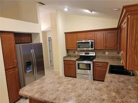 Kitchen - 1725 E Monopoly Loop, Inverness, FL 34453 photo 2 of 3