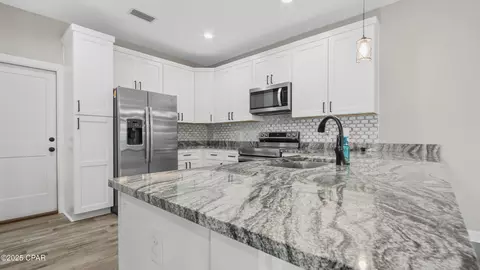 Kitchen - 1303 E 8th St, Lynn Haven, FL 32444 photo 3 of 4