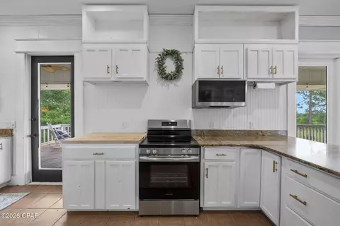 Kitchen - 24197 NW Pine Tree Trl, Fountain, FL 32438 photo 5 of 6
