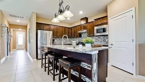 Kitchen - 8760 Ocean Tides Cv, Parrish, FL 34219 photo 2 of 3