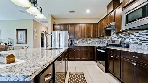 Kitchen - 8760 Ocean Tides Cv, Parrish, FL 34219 photo 3 of 3