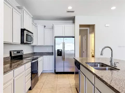 Kitchen - 6307 Pin Cherry Pl, Riverview, FL 33578 photo 3 of 7