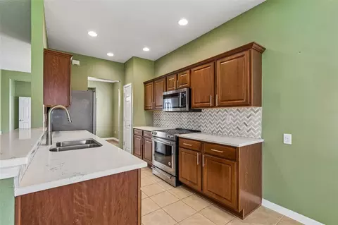 Kitchen - 10448 48th Ct E, Parrish, FL 34219 photo 3 of 4