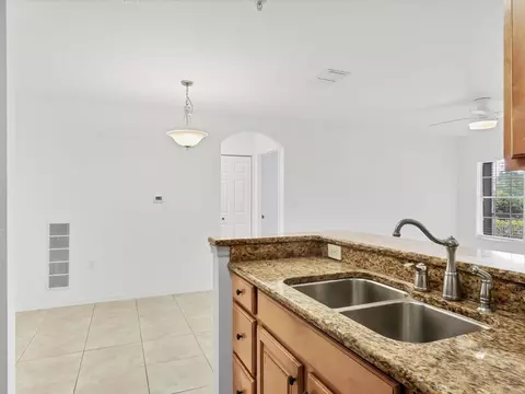 Kitchen - 8933 Manor Loop #105, Bradenton, FL 34202 photo 4 of 4