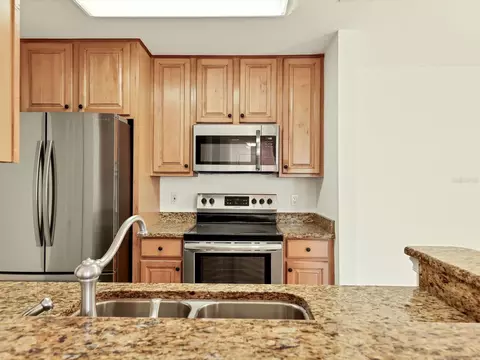 Kitchen - 8933 Manor Loop #105, Bradenton, FL 34202 photo 3 of 4