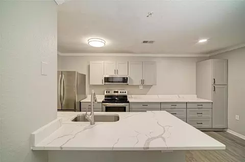 Kitchen - 8932 Manor Loop #102, Bradenton, FL 34202 photo 5 of 8