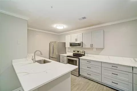 Kitchen - 8932 Manor Loop #102, Bradenton, FL 34202 photo 4 of 8