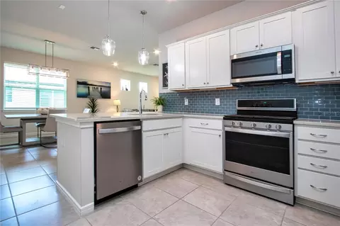 Kitchen - 8427 Ocean Tides Cv, Parrish, FL 34219 photo 5 of 6