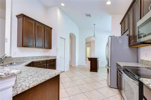 Kitchen - 8443 White Poplar Dr, Riverview, FL 33578 photo 7 of 9