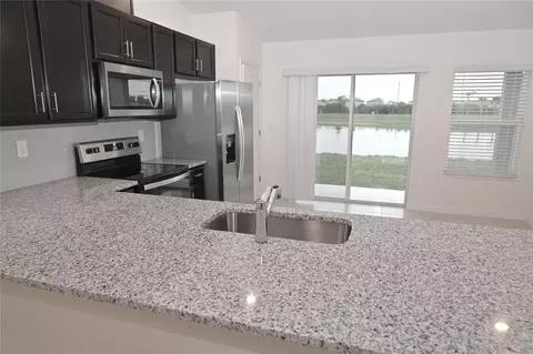 Kitchen - 9532 Sandy Bluffs Cir, Parrish, FL 34219 photo 2 of 7